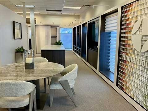 Store interior showcasing several different types of window coverings